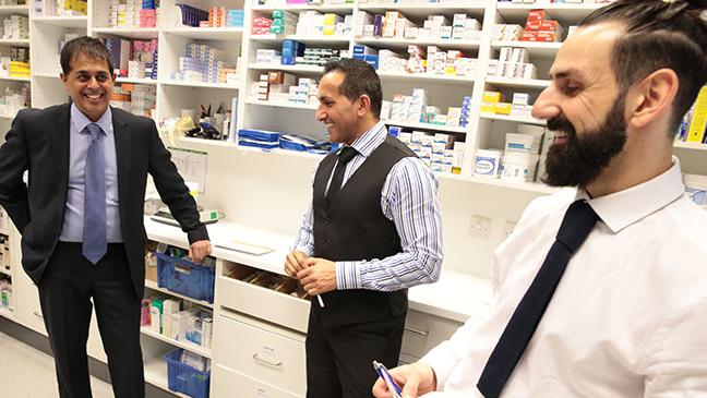 community pharmacists having hearty conversation